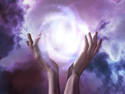 adult-holding-ball-light